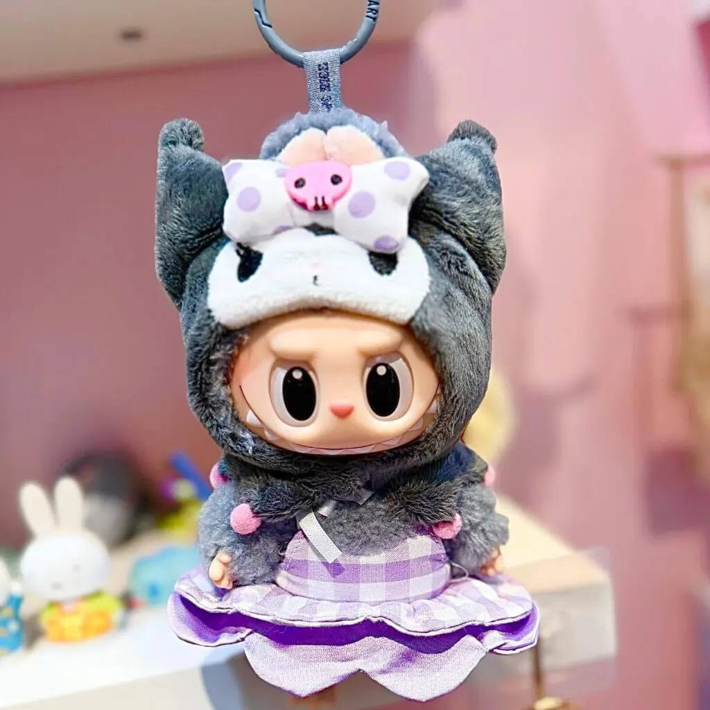Kuromi from Hello Kitty Labubu release hanging on a shelf