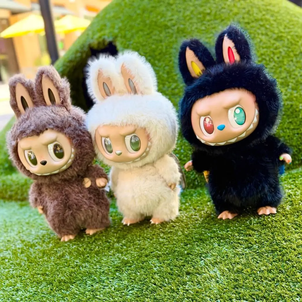 Zimomo I Found You, Angel in Clouds, and 10th Anniversarystanding standing on a faux grass