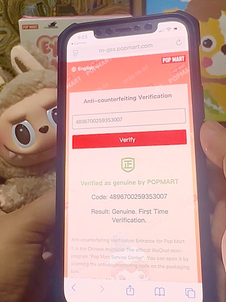 Proof showing positive QR scan of authentic Labubu Toffee doll (in background)