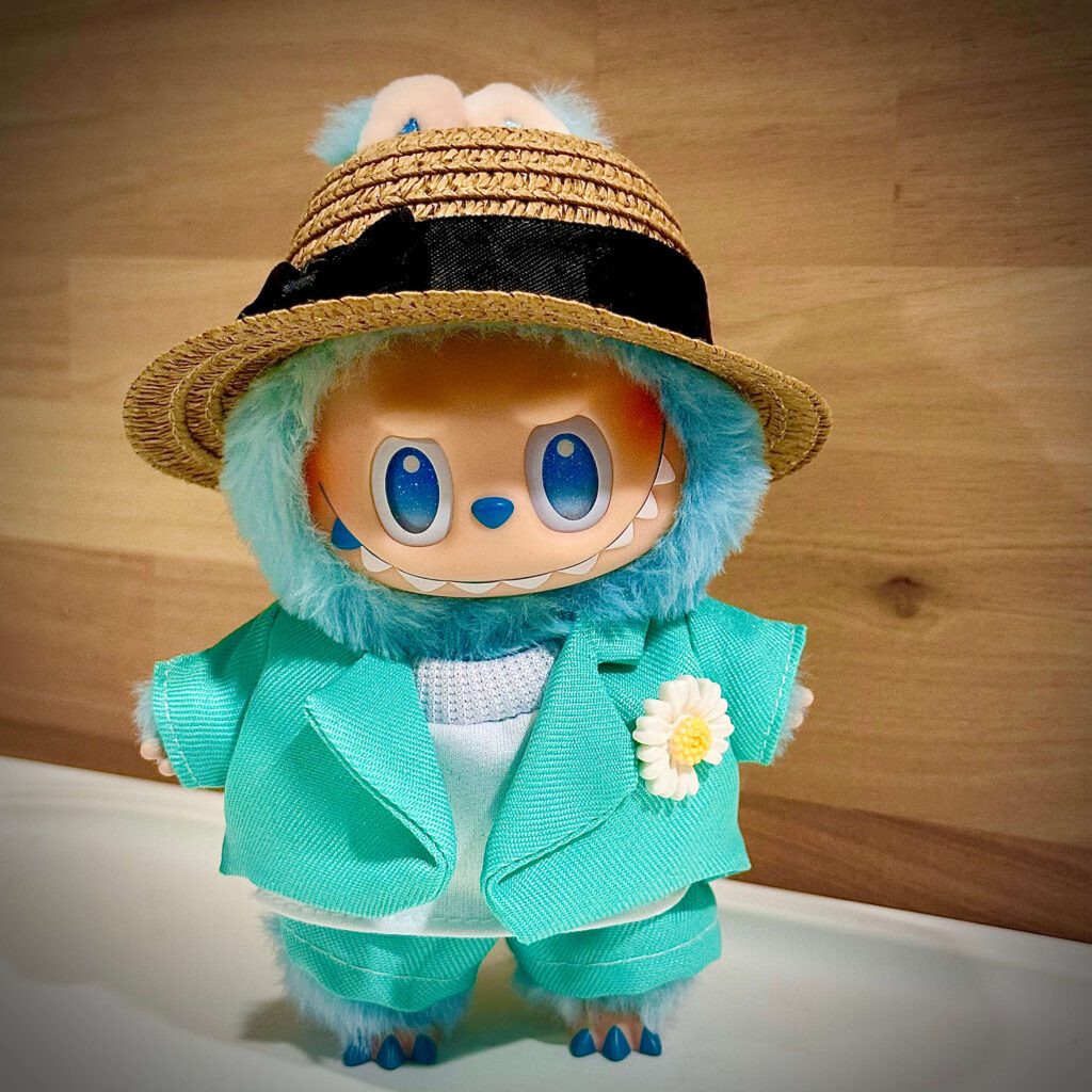 hope labubu clothes green coat with hat wood background