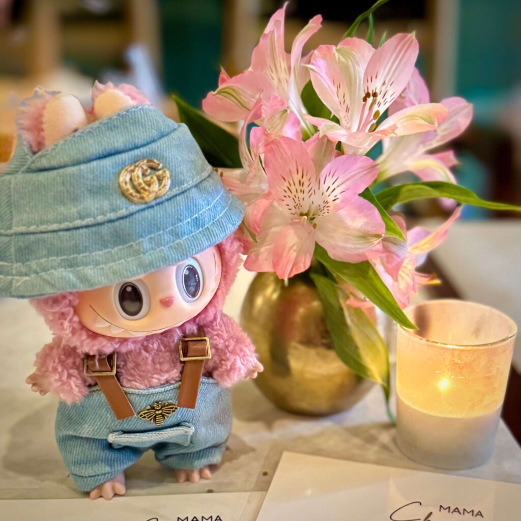 lychee berry labubu clothes in fancy restaurant