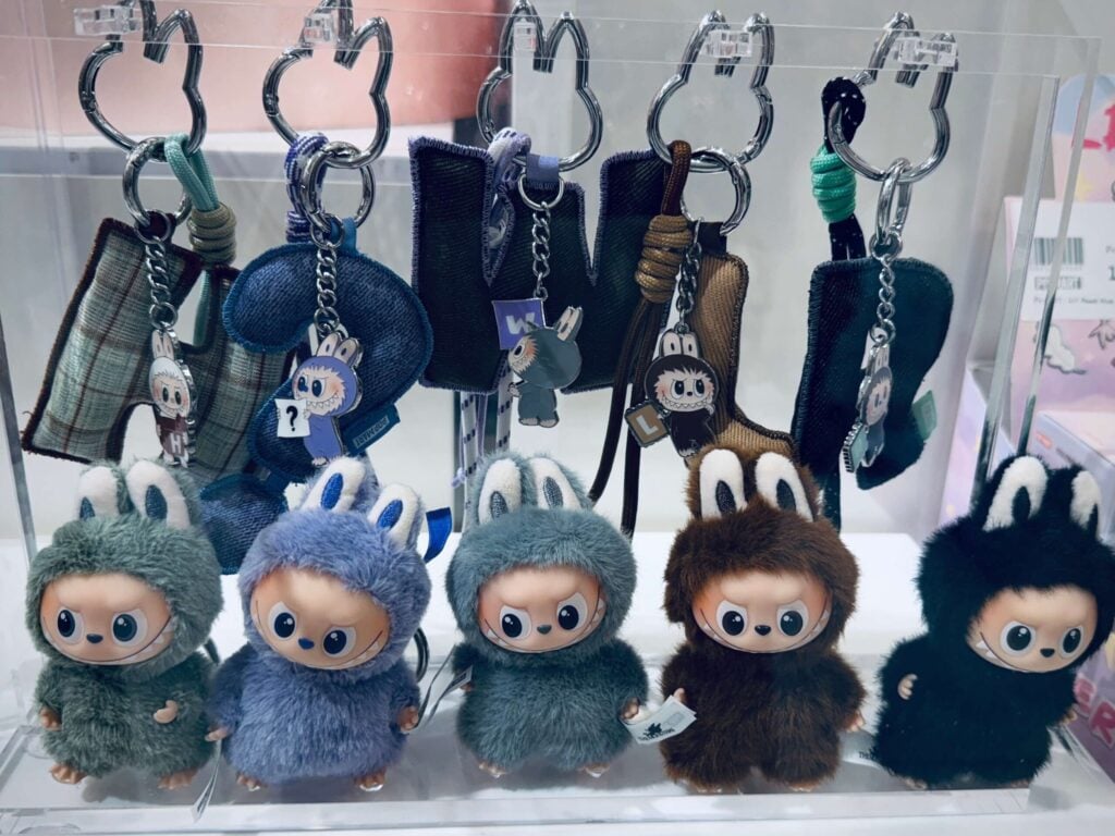 mini Labubu Pin for Love group photo Pop Mart store display