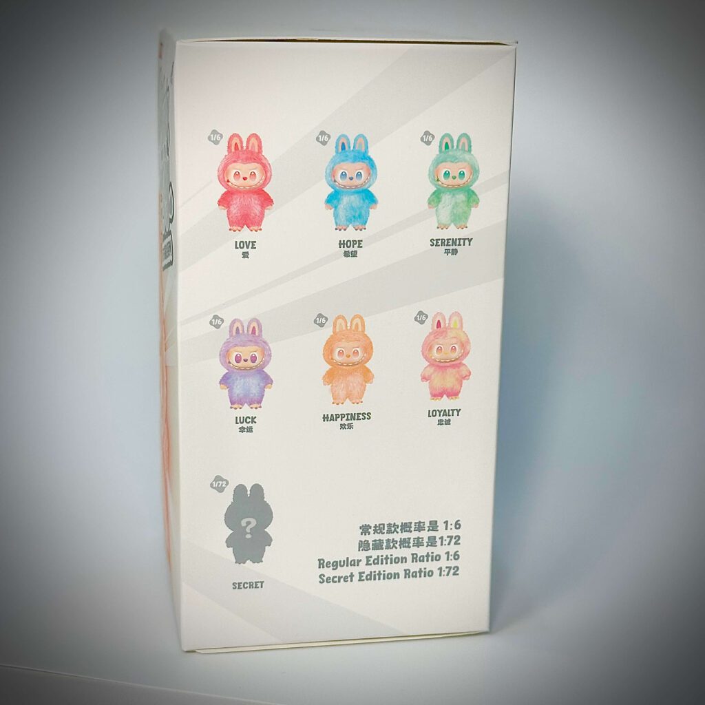 labubu big into energy box right side with either Love, Happiness, Loyalty, Serenity, Hope, Lucky or Secret Character ID inside