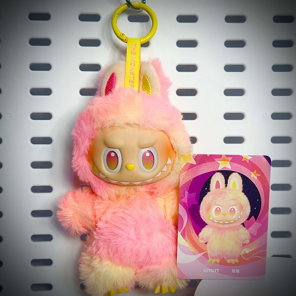 labubu big into energy loyalty hung with name card