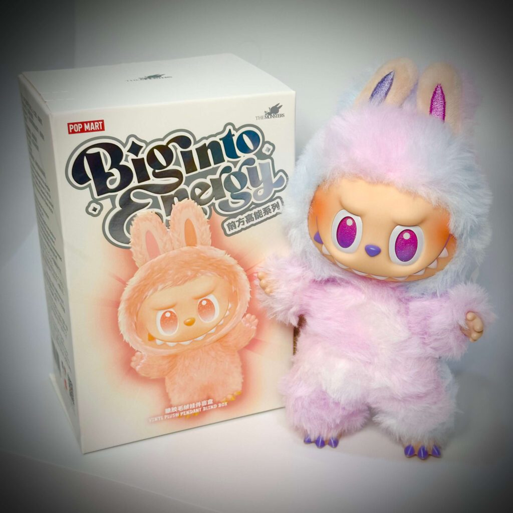 labubu big into energy luck beside box