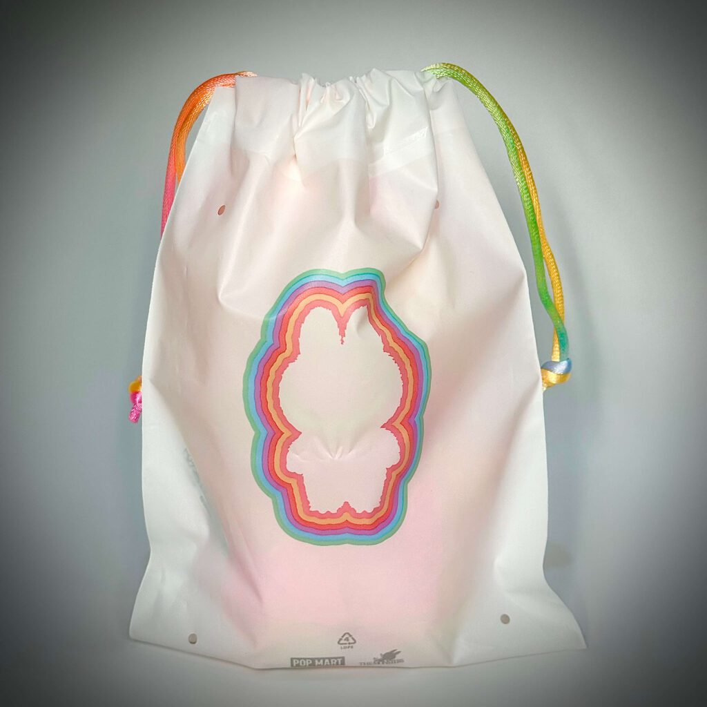 labubu big into energy pouch back with either Love, Happiness, Loyalty, Serenity, Hope, Lucky or Secret Character ID inside