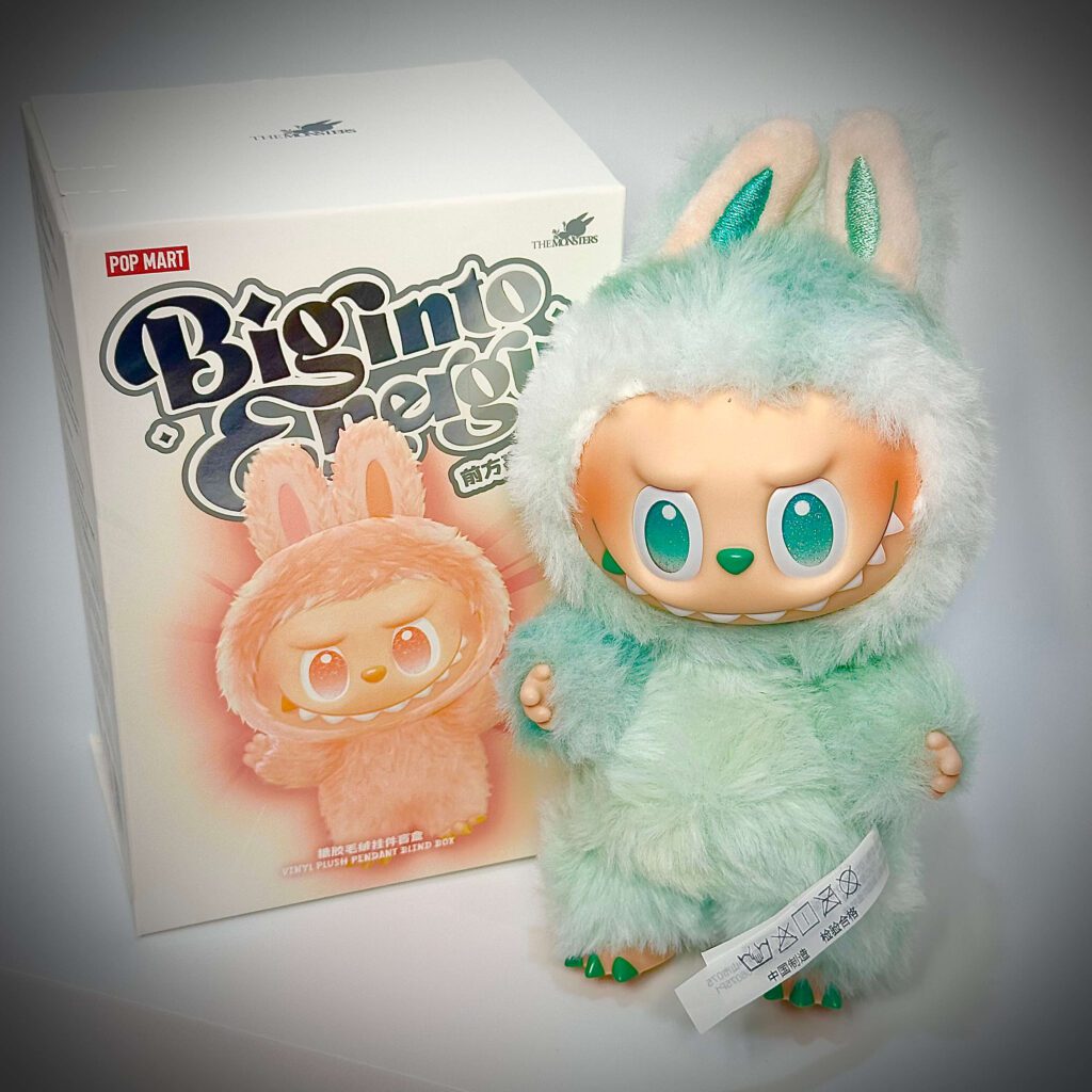 labubu big into energy serenity beside box