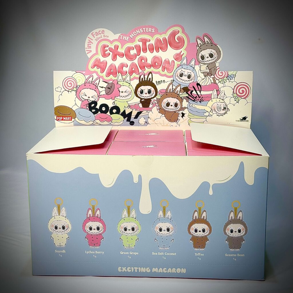 labubu exciting macaron box opened with labubu exciting macaron group photo with labubu grape grape, toffee, Lychee Berry, Sea Salt Coconut, Soymilk, Sesame Bean inside