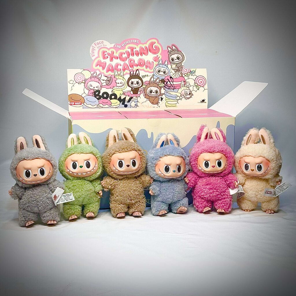 labubu exciting macaron group photo with labubu grape grape, toffee, Lychee Berry, Sea Salt Coconut, Soymilk, Sesame Bean