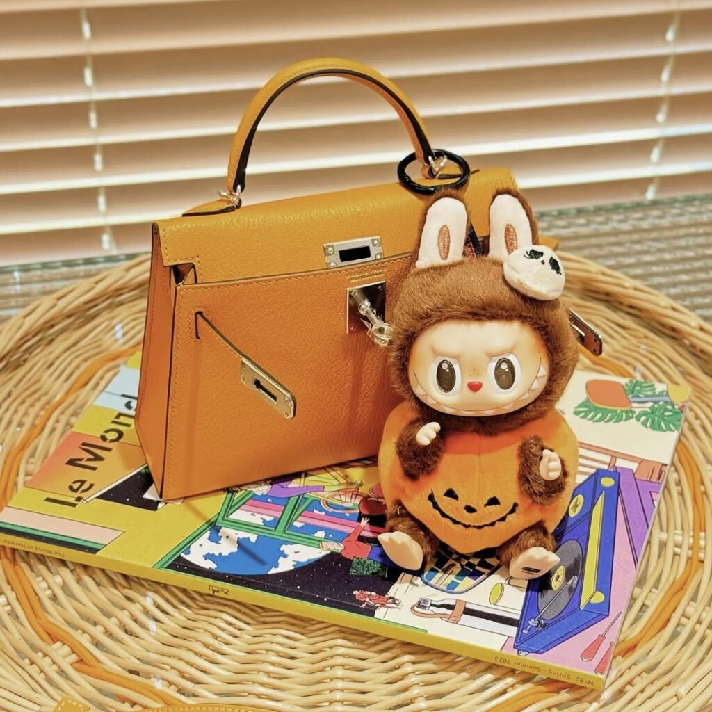 labubu halloween sitting pumpkin in brown bag