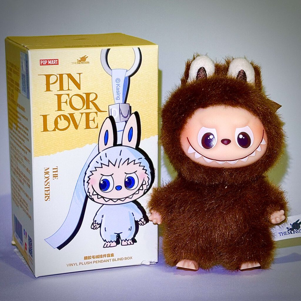 mini labubu pin for love L beside box
