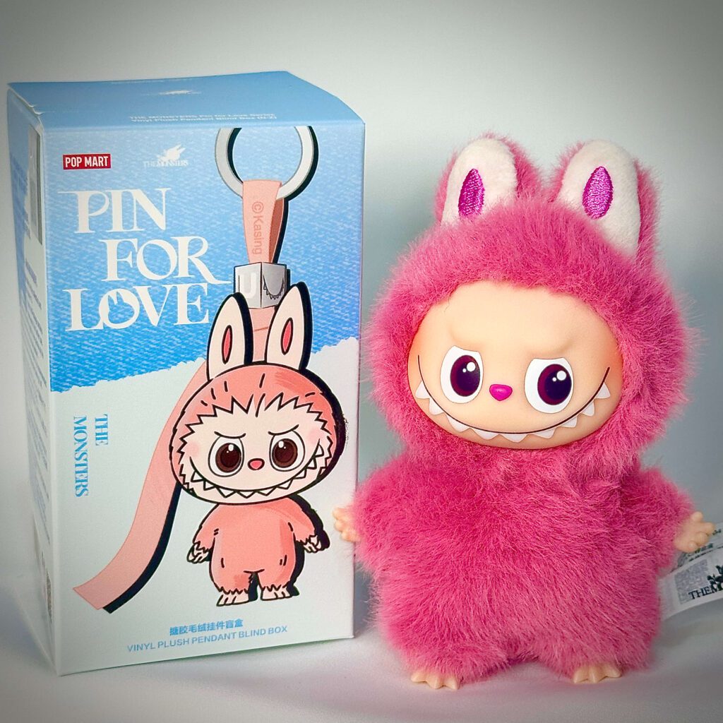 mini labubu pin for love q beside box