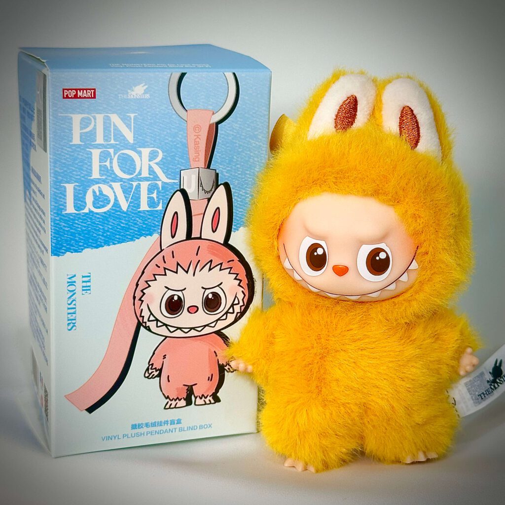 mini labubu pin for love y beside box