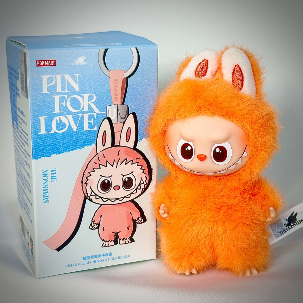 mini labubu pin for love z beside box