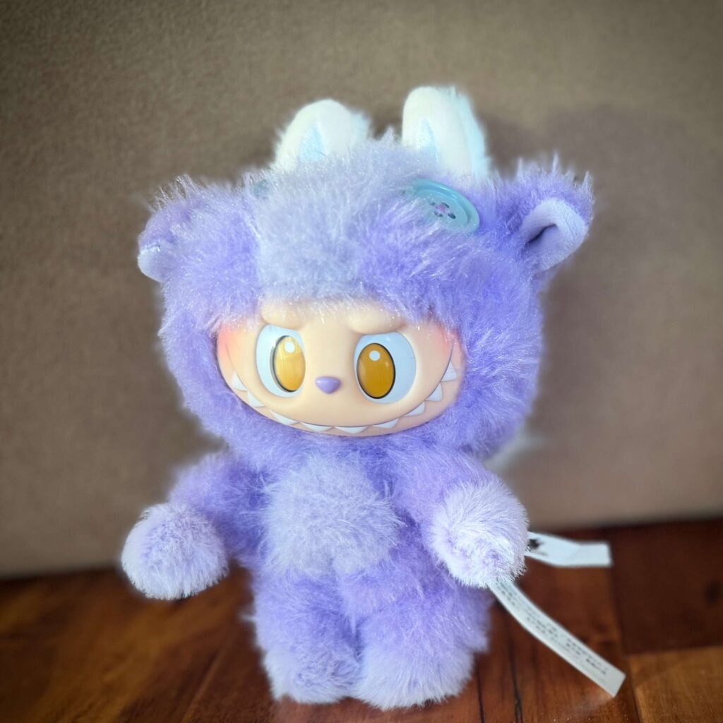 Front view of the Pop Mart Labubu Happy Family plush doll from the 2026 Have a Good Run CNY series.