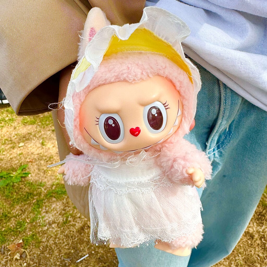 Mokoko Fall Into Spring keychain doll held in hand